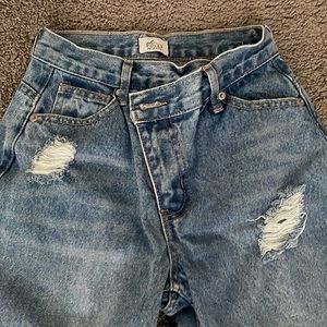 Ripped criss cross ankle jeans